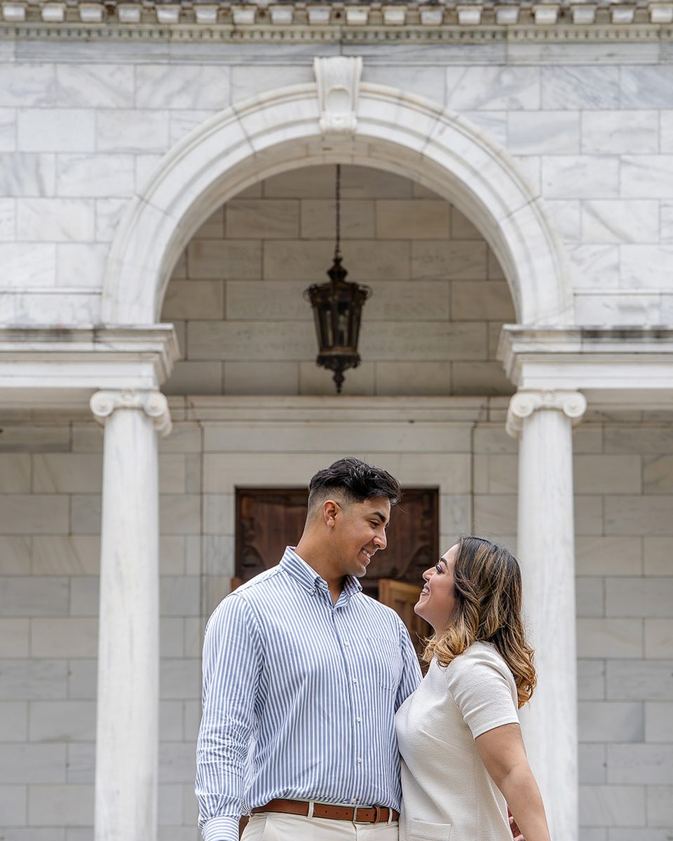 Engaged couple under the arch of the Brooks Museum of Art, Memphis