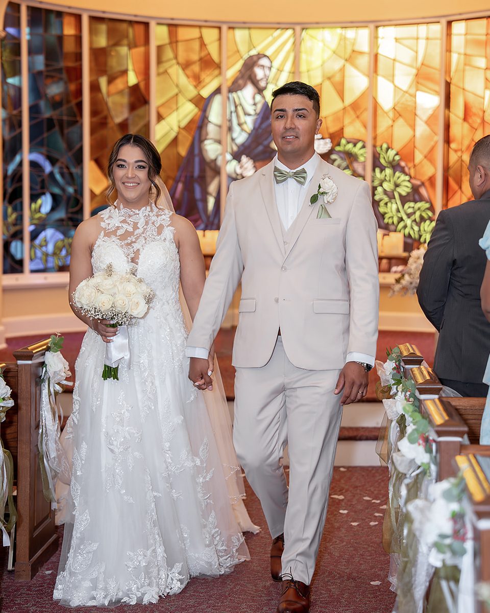 Couple beneath stained glass at a Germantown, TN church wedding