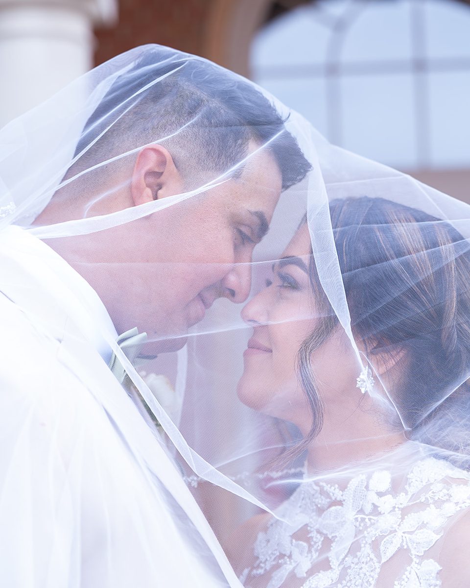 Bride and groom under her veil at a Germantown, TN wedding