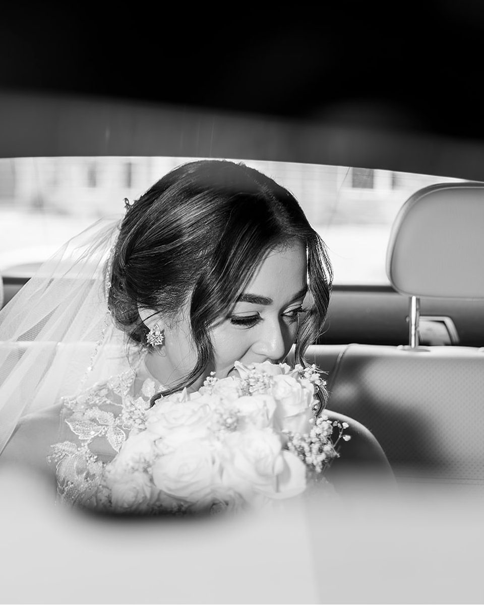 Bride in the getaway car at a Hyatt Centric Memphis wedding, black and white