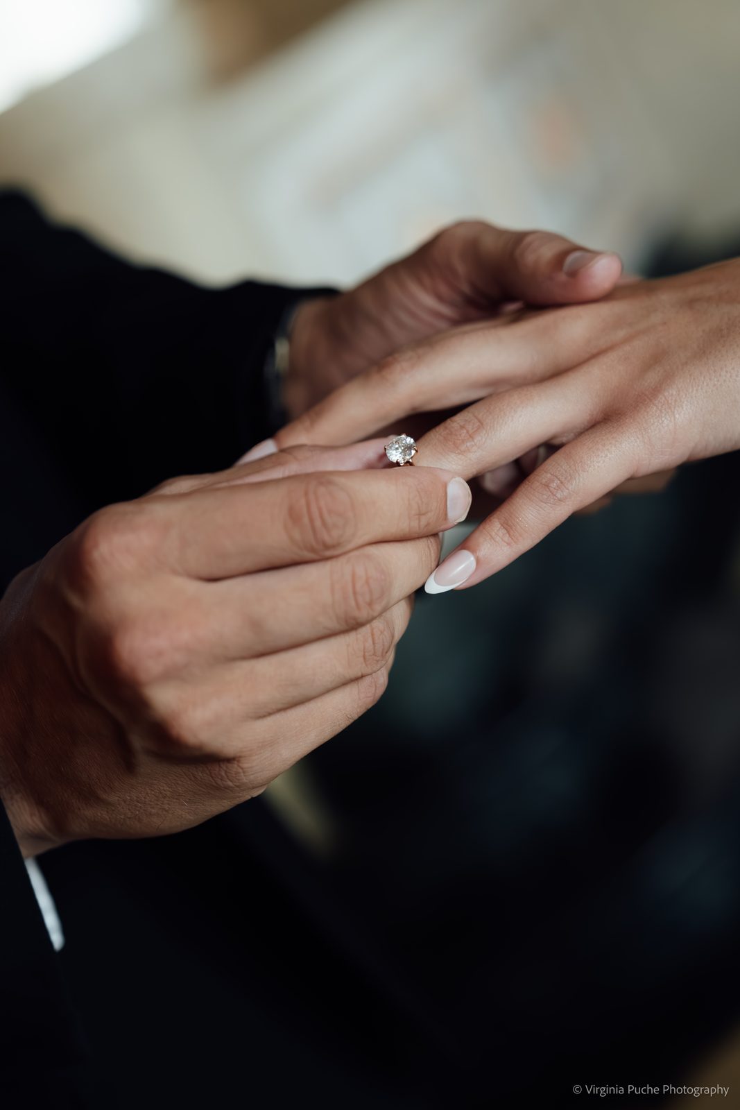 Groom slipping the ring onto the bride's finger at a Memphis wedding