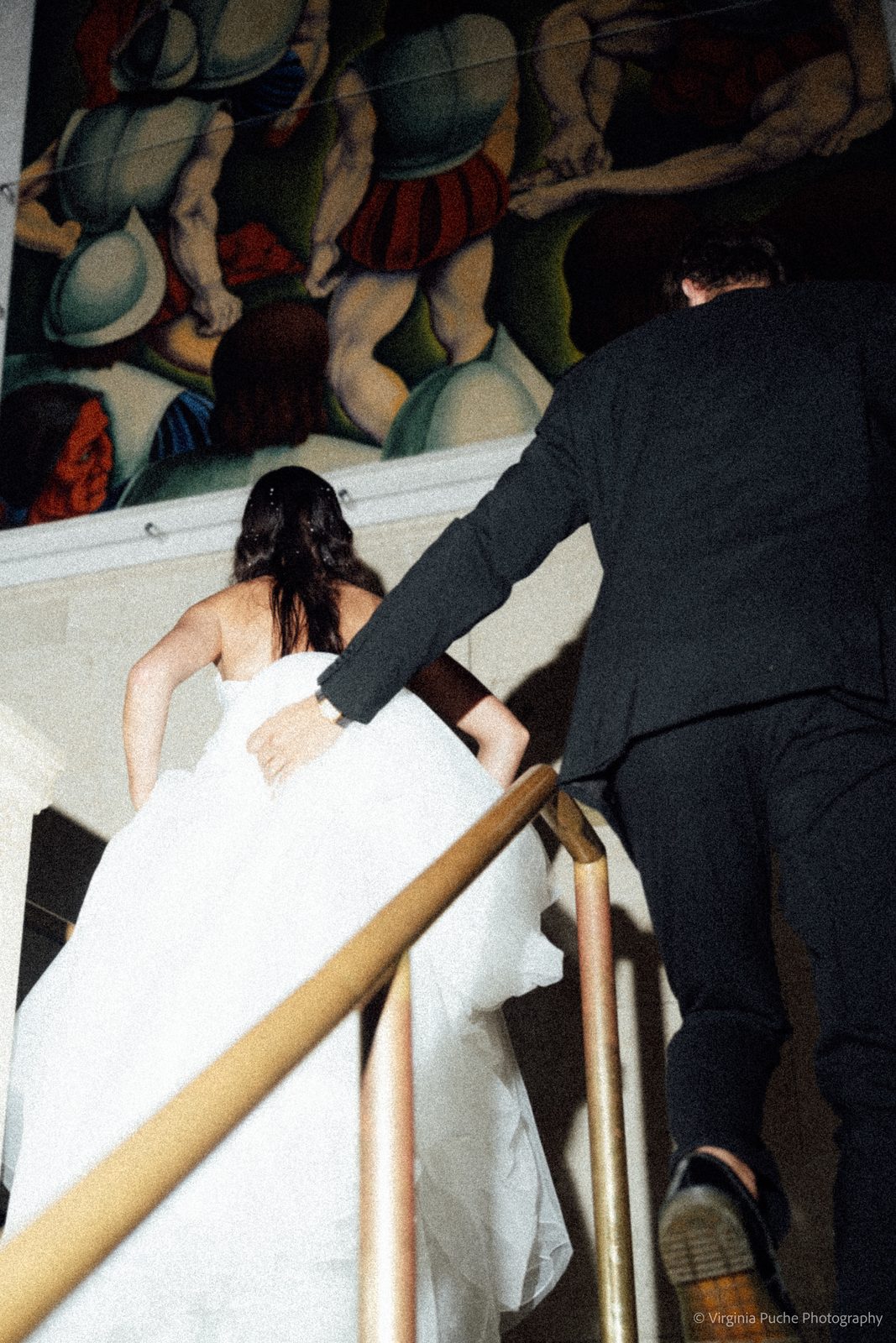 Memphis wedding couple walking up the museum stairs
