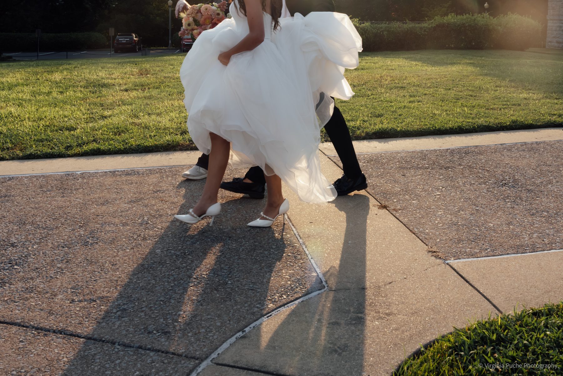 Memphis groom carrying his bride at golden hour