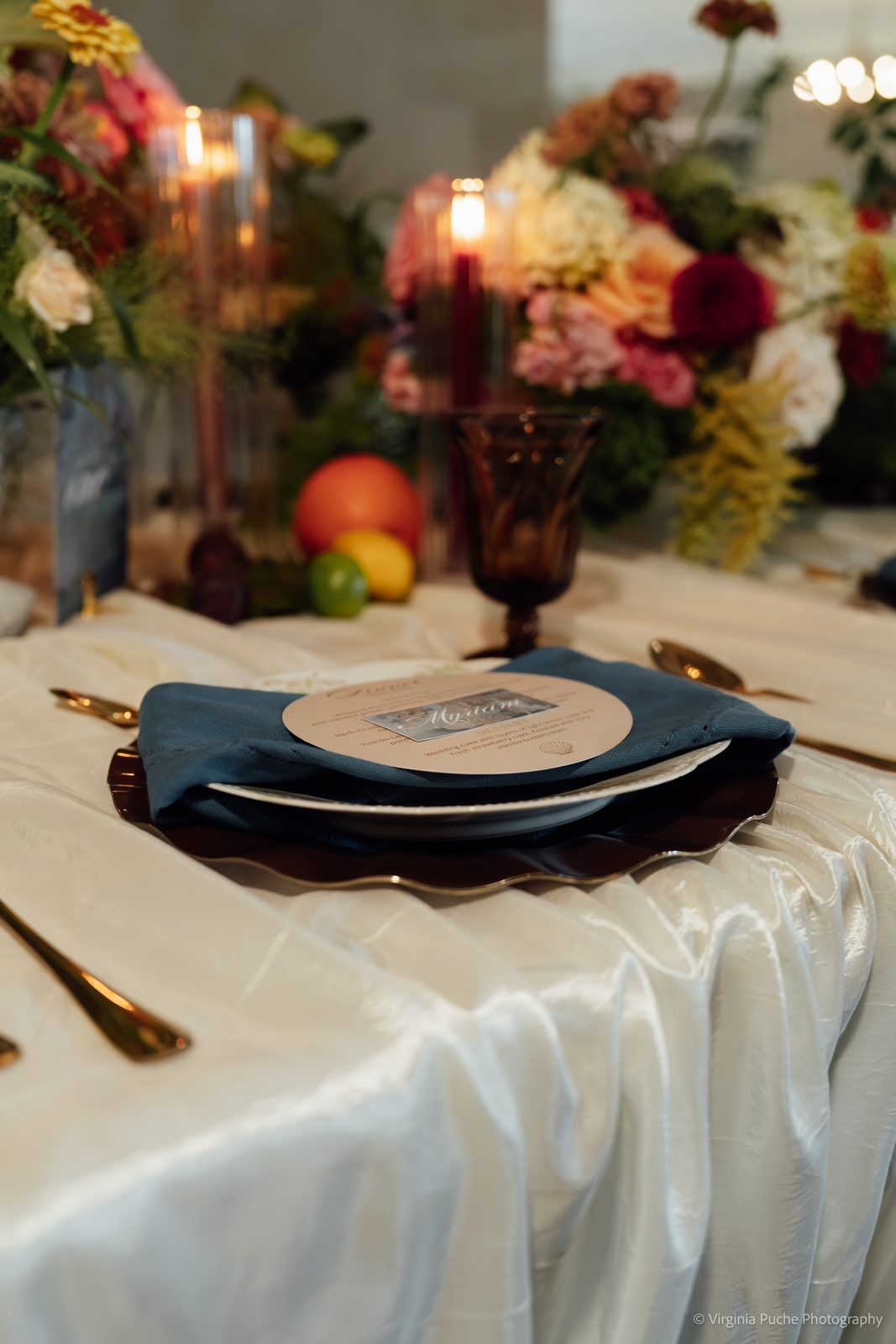 Memphis wedding reception place setting with candles and florals