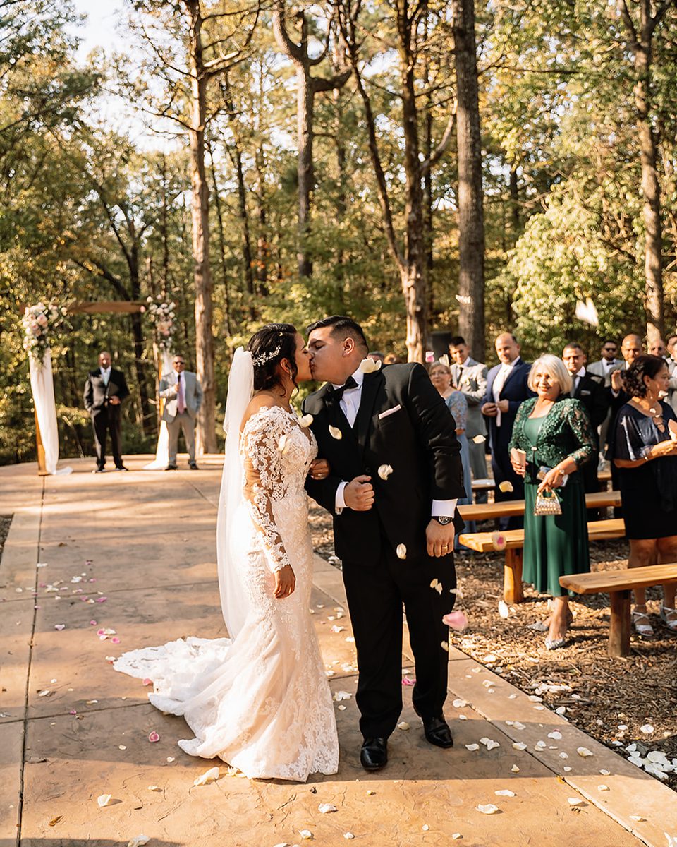 Outdoor autumn ceremony among the trees at an Orion Hill wedding