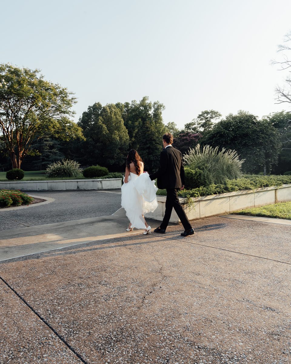 Elopement couple walking the grounds of the Pink Palace Mansion, Memphis