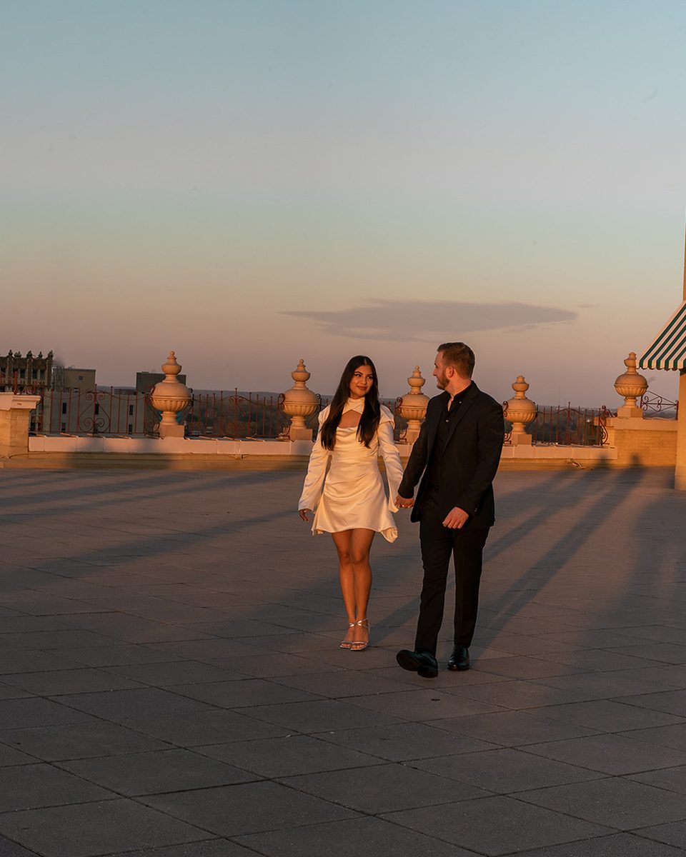 Engaged couple on the Peabody Hotel rooftop at dusk, Memphis